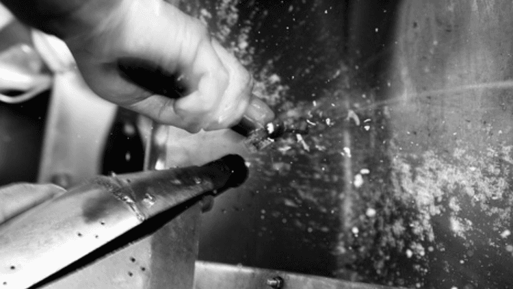 Disgorging a champagne bottle