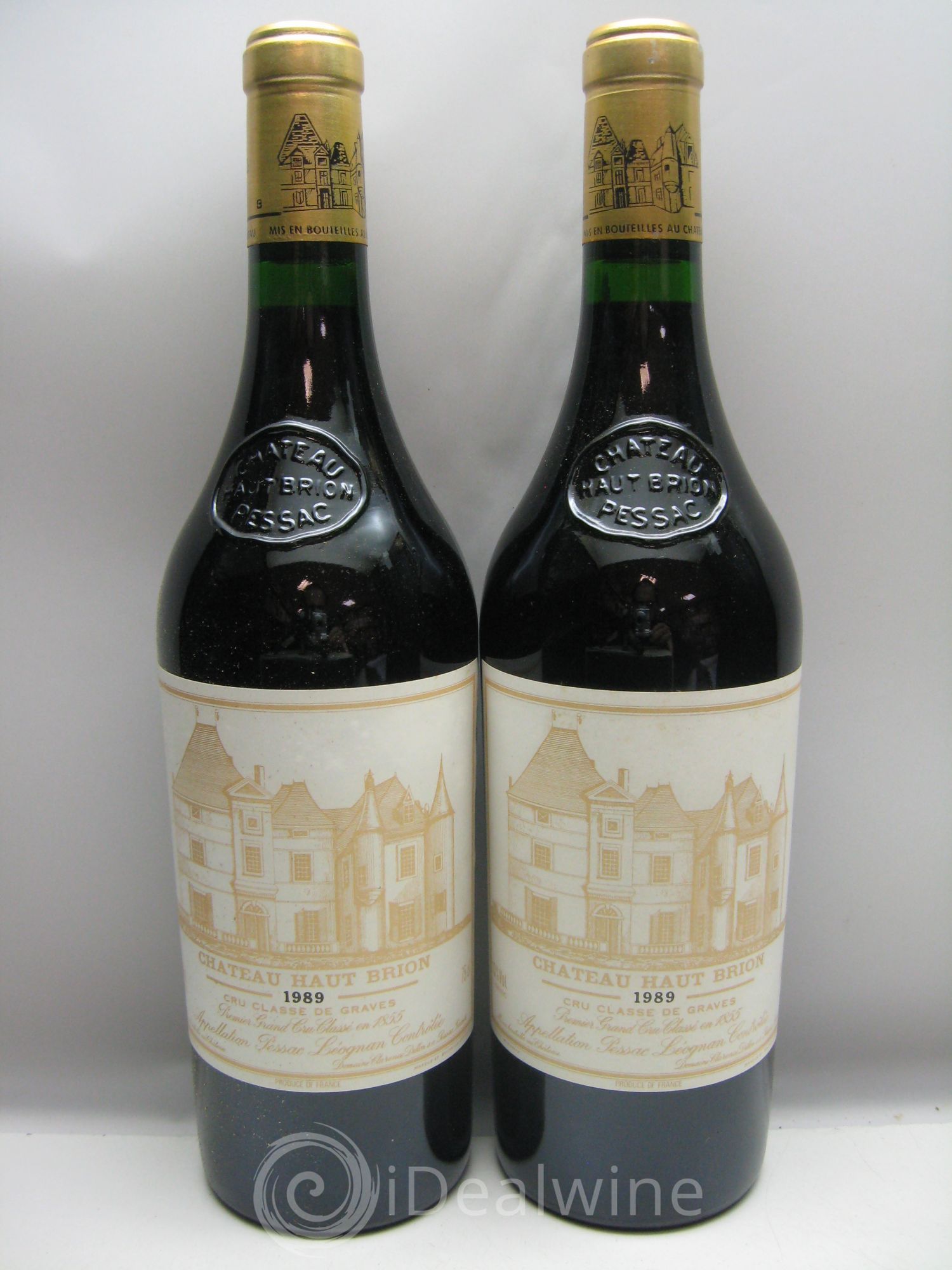 Château Haut Brion 1er Grand Cru Classé Caisse bois très abimée et humide -  1989 - Lotto di 12 bottiglie - 1